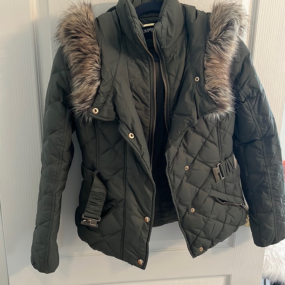 Short green puffer coat.